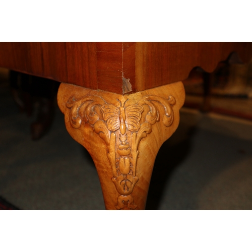 354 - A walnut and feather banded lowboy, fitted seven drawers, on carved cabriole supports, 43