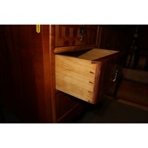 354 - A walnut and feather banded lowboy, fitted seven drawers, on carved cabriole supports, 43