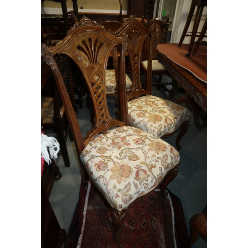 355 - A French style walnut and banded oval dining table with carved frieze, on two bulbous tripod splay s... 