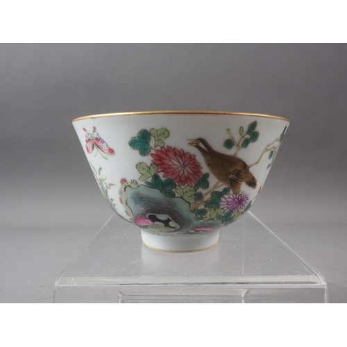 68 - A Chinese porcelain bowl with bird, flower and insects in a landscape decoration, four-character mar... 