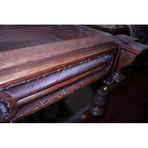 278 - An Edwardian walnut fold-over card table, on carved acanthus and reeded supports united by an undert... 