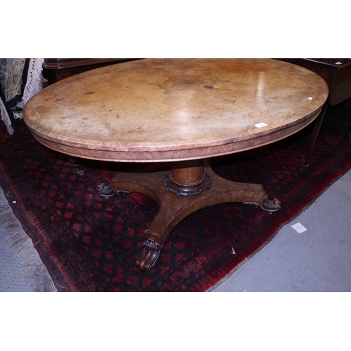 279 - A 19th century figured walnut loo table, on turned column and quatrefoil base, 53