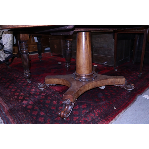 279 - A 19th century figured walnut loo table, on turned column and quatrefoil base, 53