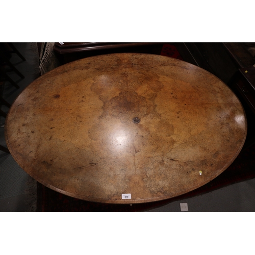 279 - A 19th century figured walnut loo table, on turned column and quatrefoil base, 53