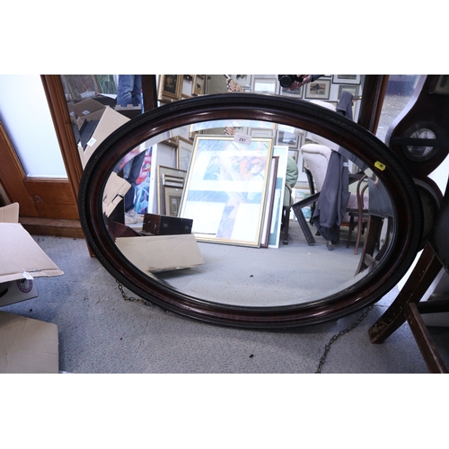 297 - A bevelled plate oval mirror, 29