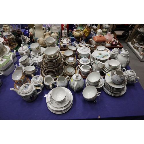 31 - A large collection of Oriental eggshell ceramics, some teacups with lithophane bases