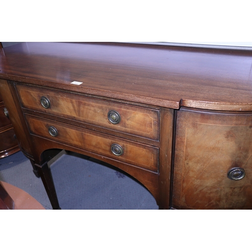 317 - An Edwardian mahogany break bowfront sideboard, fitted two central drawers and flanked cupboards, on... 