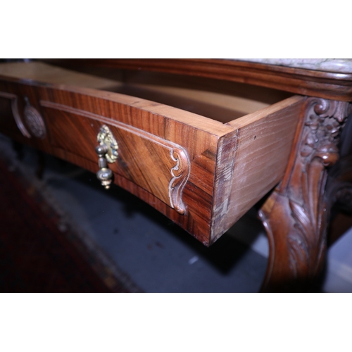 352 - A French style carved walnut serpentine front side table with marble top over two drawers, on cabrio... 