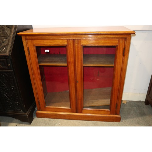 268 - A late 19th century mahogany bookcase enclosed glazed panel doors, on block base, 40