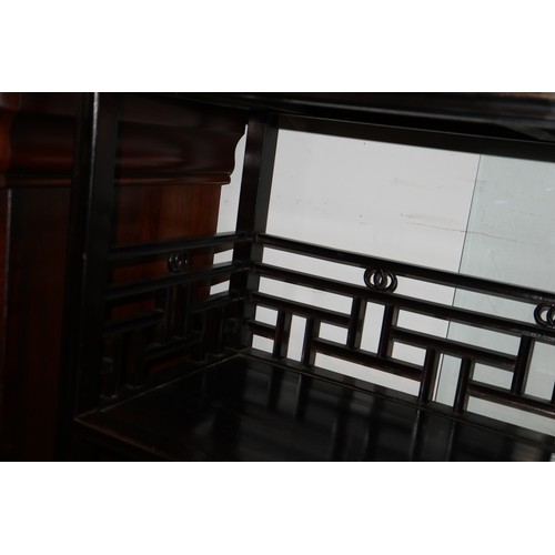 308 - A Chinese ebonised hardwood open bookcase, fitted two centre drawers, 34