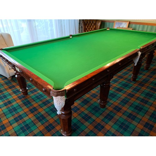 261 - A Cox and Yemen late Victorian mahogany billiard table, on faceted supports, complete with cues, res... 