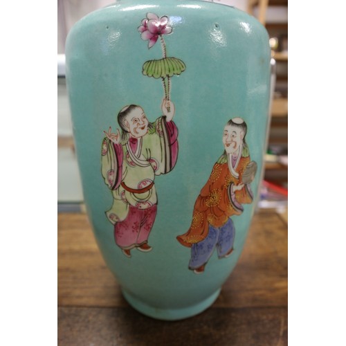 80 - A pair of Chinese porcelain baluster vases with figure, beast and butterfly decoration on a teal gro... 