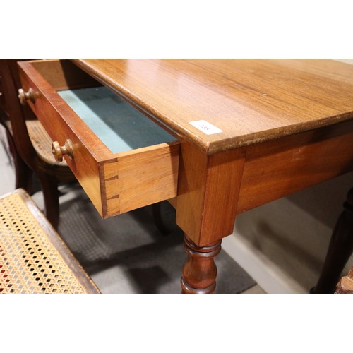 335 - A mahogany side table, fitted two drawers, on turned supports, 48