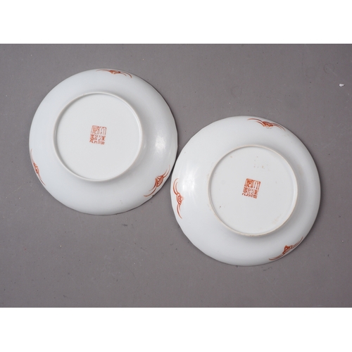 104 - A pair of shaped edge Chinese porcelain dishes, decorated with figures by a river, seal mark to base... 