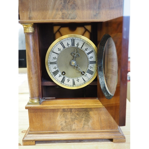 135 - A 19th century Danish figured mahogany mantel clock with silvered chapter ring and eight-day strikin... 