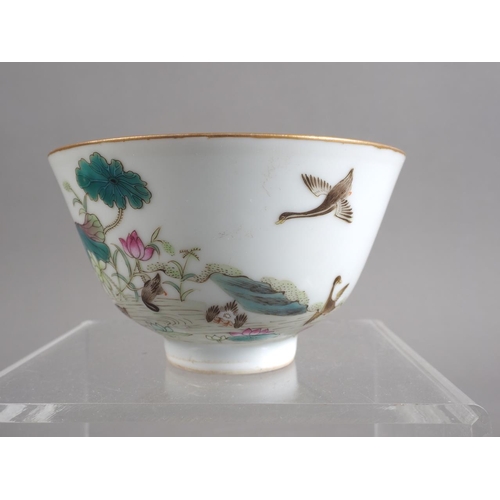 106 - A Chinese porcelain bowl with bird, flower and insects in a landscape decoration, four-character mar... 