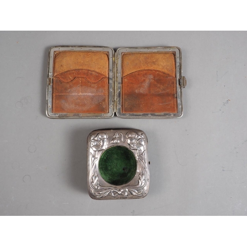 322 - An Art Nouveau silver mounted pocket watch case and a leather purse with silver corners