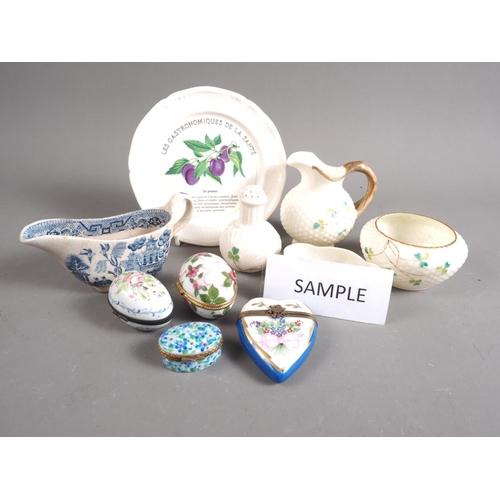 62 - Four pieces of Belleek shamrock decorated porcelain, a Willow pattern miniature sauce tureen, a boxe... 