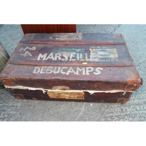 673 - An early 20th century leather Marseille suitcase with wood battens, 31