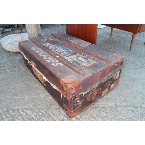 673 - An early 20th century leather Marseille suitcase with wood battens, 31