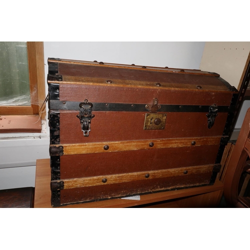 676 - A dome top travel trunk