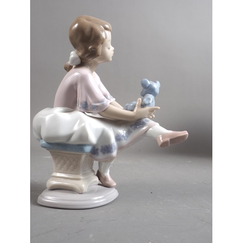 75 - A Lladro figure of a girl with a teddy bear, 6