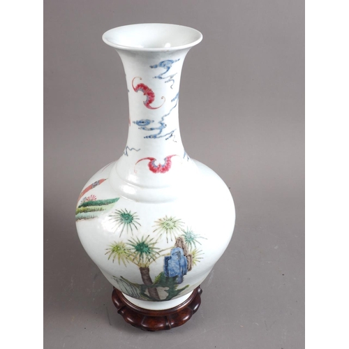 82 - A Chinese porcelain famille rose bulbous vase, decorated figure and Kylin with bats and clouds, seal... 