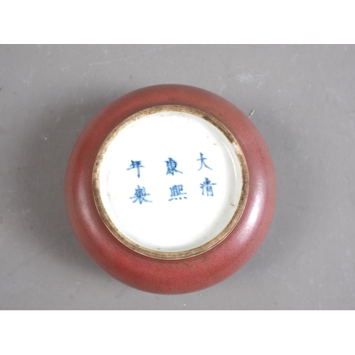 88 - A Chinese porcelain sang de boeuf paste pot, six-character mark to base, 3 1/4