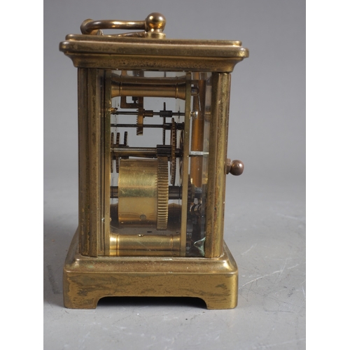 150 - A carriage clock with gilt brass case, 4