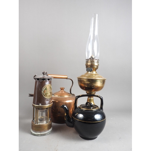 172 - A S L type M & Q safety lamp, a brass oil lamp, a copper kettle and a teapot