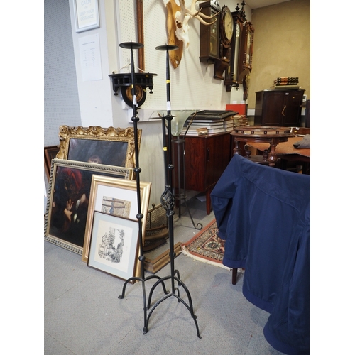 251 - A pair of brass and black lacquered adjustable desk lamps, on circular bases