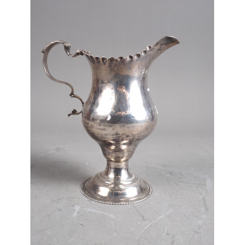 312 - A Georgian silver pedestal cream jug, 3oz troy approx