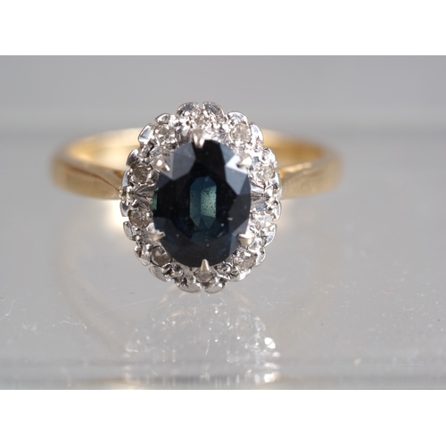 353 - An 18ct gold, sapphire and diamond cluster ring, size N, 4.55g