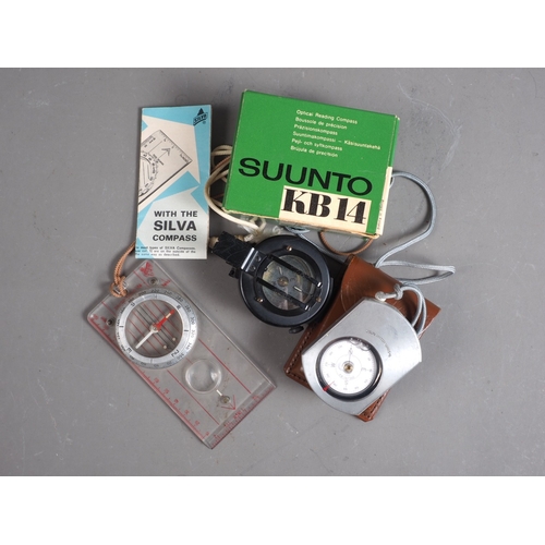 129 - An N9 prismatic military compass with mother-of-pearl compass card, a Sunto KB14 compass, in leather... 