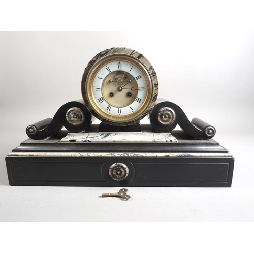 140 - A black slate and grey marble mounted clock with cylindrical movement, 12