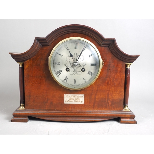 142 - An early 20th century mahogany cased mantel clock with silvered dial and eight-day striking movement... 