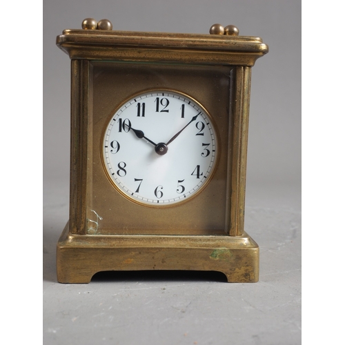 150 - A carriage clock with gilt brass case, 4