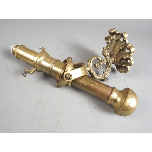 162 - A ship's 19th century brass gimballed candlestick, on acanthus scroll bracket, 10