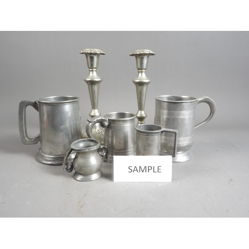 170 - A pewter quart tankard, two pewter pint mugs and other pewter measures