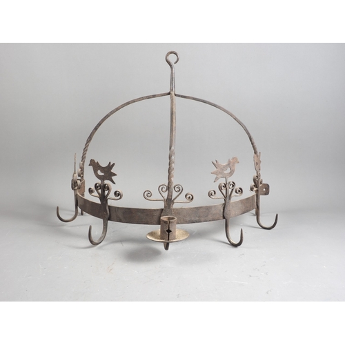 175 - A wrought iron semi-circular wall mounted game hanger, 21