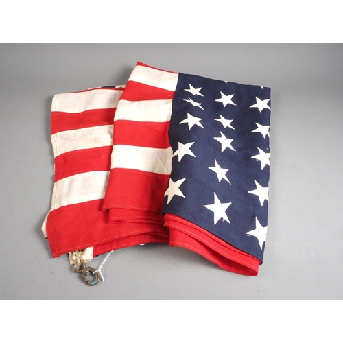 209 - A USA flag from US Navy Stores with brass fittings, 40