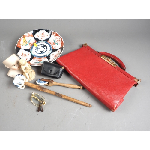 224 - A lady's red leather handbag, a blue and white porcelain whisk with wooden handle, a pastry cutter, ... 