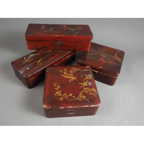 226 - Two Japanese lacquered square-shaped boxes and covers, and a similar pair of rectangular boxes and c... 