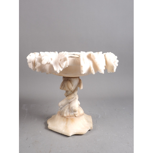 234 - A carved alabaster table centre, 9