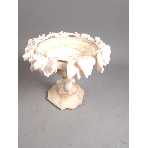 234 - A carved alabaster table centre, 9