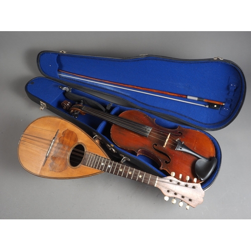 236 - A Neopolitan rosewood mandolin (split sound board) and a student's German violin, in case