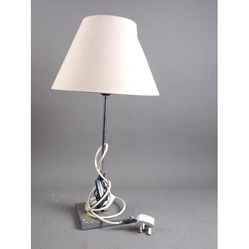 250 - An adjustable angle chrome and stone base table lamp, 20