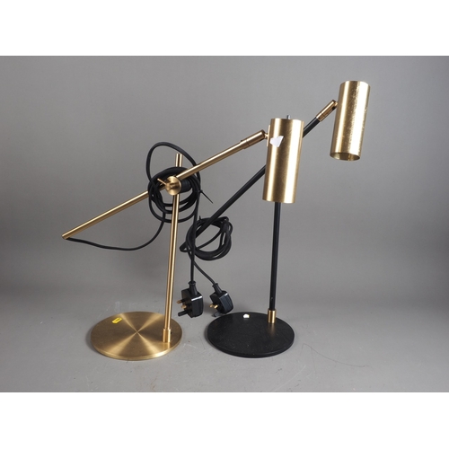 251 - A pair of brass and black lacquered adjustable desk lamps, on circular bases