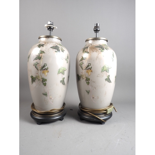 261 - A pair of grey glass lamp bases, decorated ivy leaves, 16