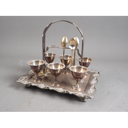 299 - A silver plated six-egg table cruet